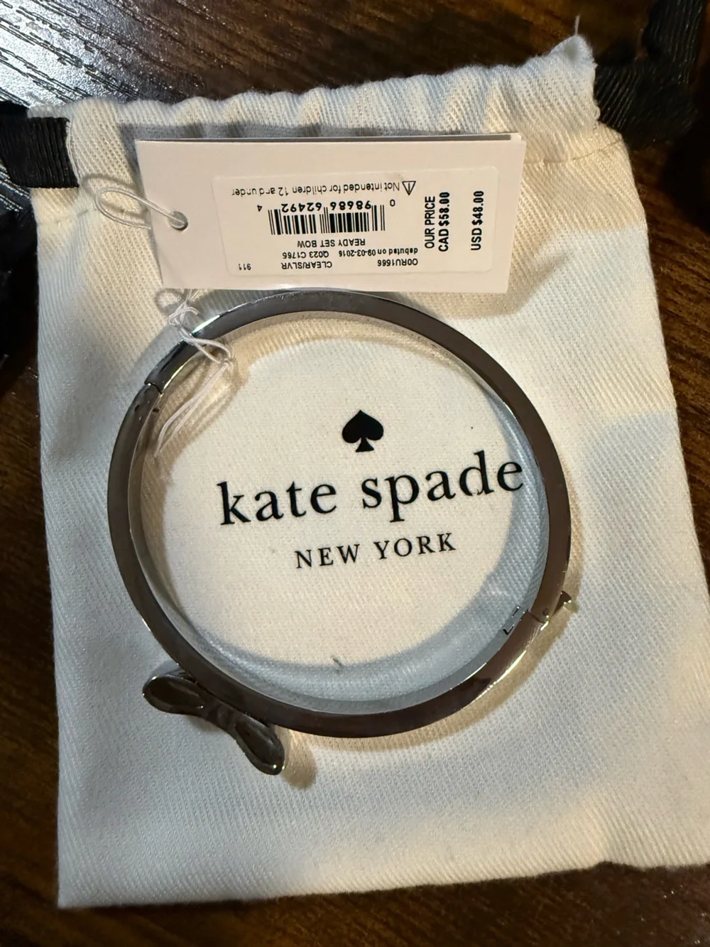 kate spade silver-tone crystal bow bangle bracelet